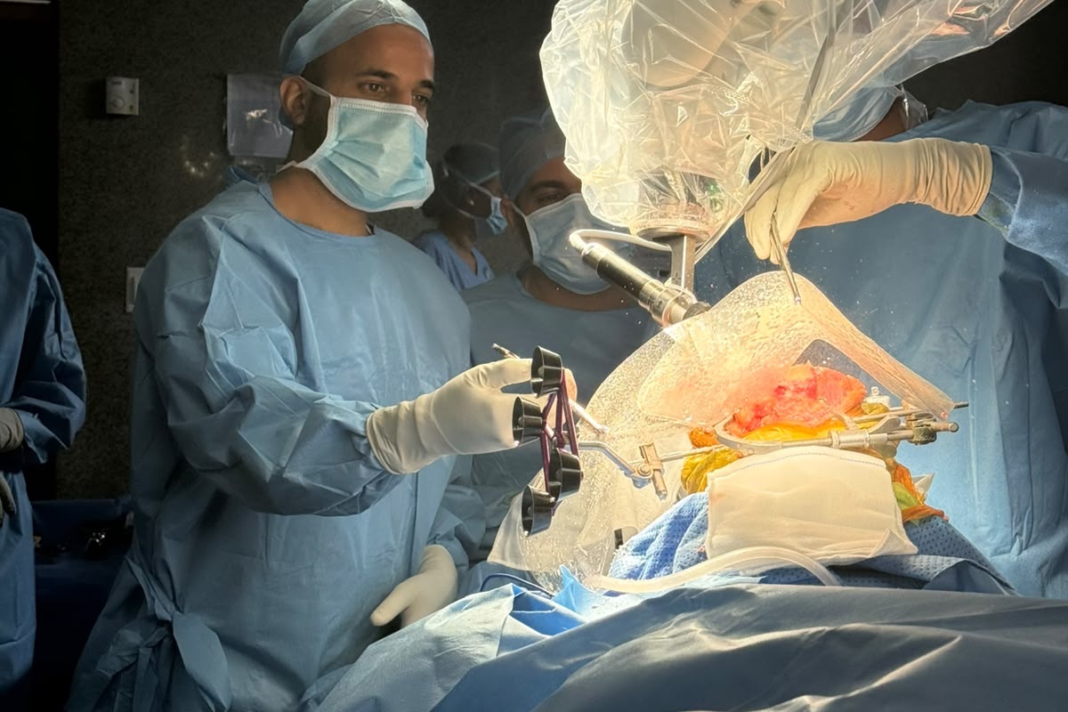 Dr. Madhuram Chowdry performing robotic-assisted knee replacement surgery in the operating room